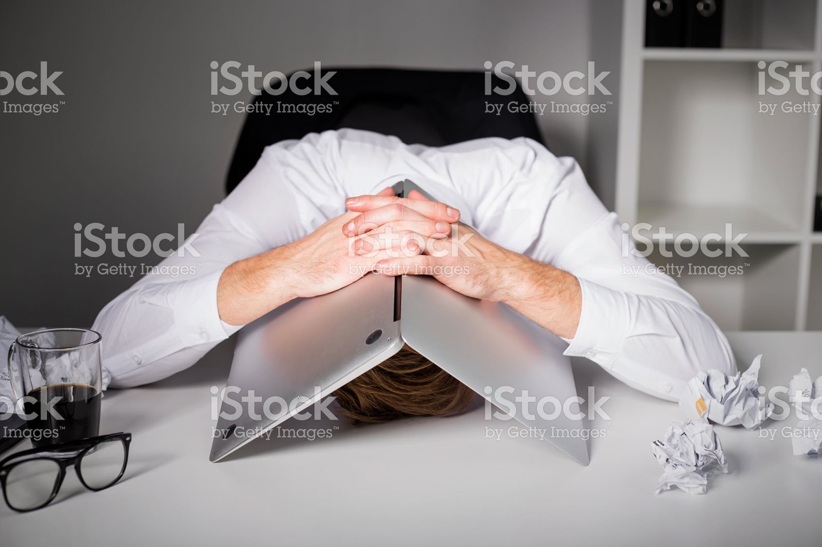Man with hands over head